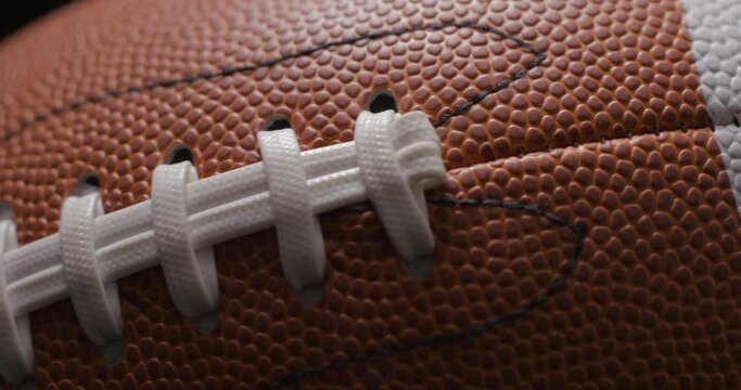 Football ball in studio close-up, macro, with smoke 4K slow-motion