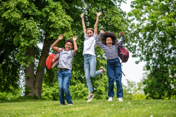 Obraz premium Group of young people feeling excited and happy in the park