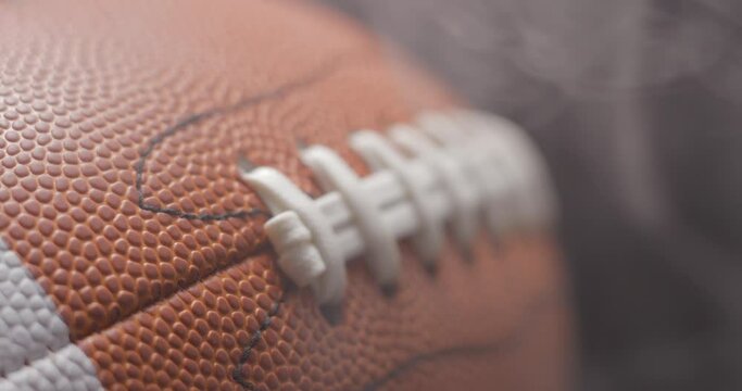 Football ball in studio close-up, macro, with smoke 4K slow-motion