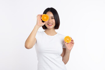 asian Woman holding halved orange on white background