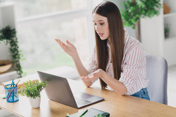 Photo of pretty shiny young girl wear striped shirt having video call modern gadget indoors apartment room