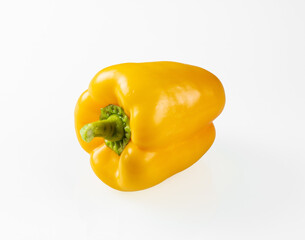 One large yellow paprika close-up on a white background