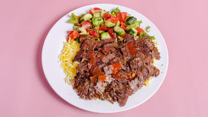 Beef portion doner kebab with rice in plate top view
