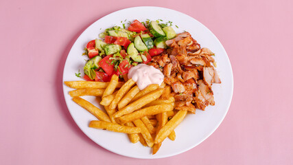 Chicken portion doner kebab with fries in plate