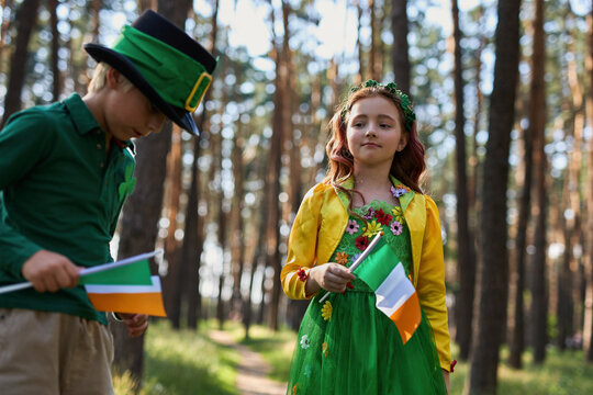 Beautiful kids celebrating St Patricks Day dressed as a fairy and a leprechaun. Happy St. Patrick's Day images collection