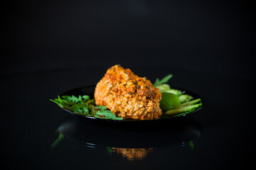 Cooked meatballs in a plate with fresh vegetables