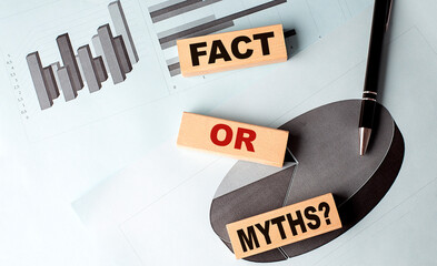 FACT OR MYTHS text on wooden block on chart background