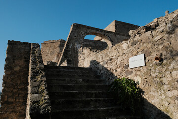 Walls ruins of the famous Aragonese Castle near Ischia Island, at the northern end of the Gulf of Naples, Italy.