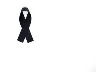 Black mourning ribbon isolated on white and copy space