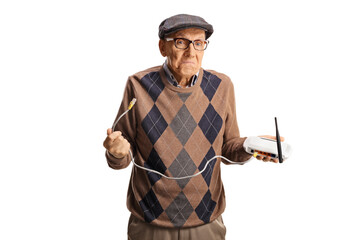 Confused elderly man holding a router
