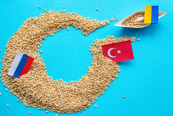 Ukrainian ship grain wheat, Turkey and Russia flags background.   Grain deal and problem of...