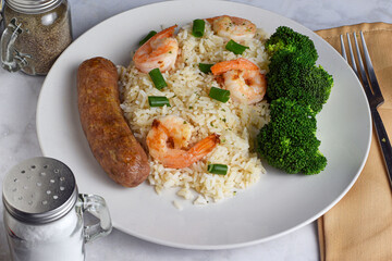 white rice top ith shrimp and green omions