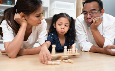 Happy kid girl play toy with future plan concept and family at home