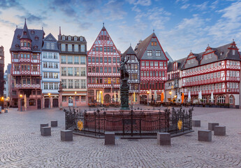 Fototapeta na wymiar Old medieval houses on the market square in Frankfurt am Main at dawn.
