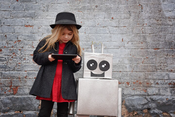 Little Cool Hipster Child on Tablet with Smart Robot