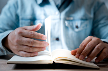 university library, reading book and relaxing. Man looking at book in library...learning. education concept..
