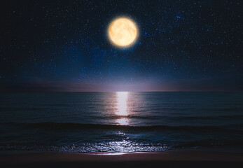 Fototapeta na wymiar Beautiful full moon in starry sky over sea at night