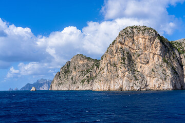 Fototapeta na wymiar Steep Rocky Cliff on the Isle of Capri in Italy Seen from the Water