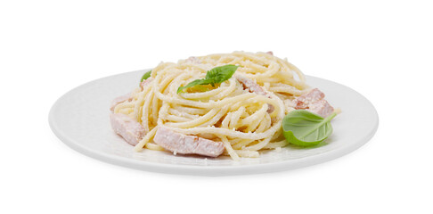 Plate of tasty pasta Carbonara with basil leaves isolated on white