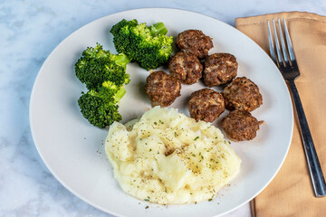 meat ball with broccoli and mashed potatoes