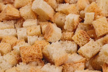 Croutons. Roasted white bread. Close-up of delicious croutons. Macro shot of croutons.