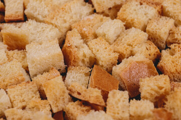 Croutons. Roasted white bread. Close-up of delicious croutons. Macro shot of croutons.
