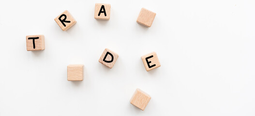 Fototapeta na wymiar Trade symbol. Wooden cubes with word Trade. Beautiful white background. Trade concept. Copy space.