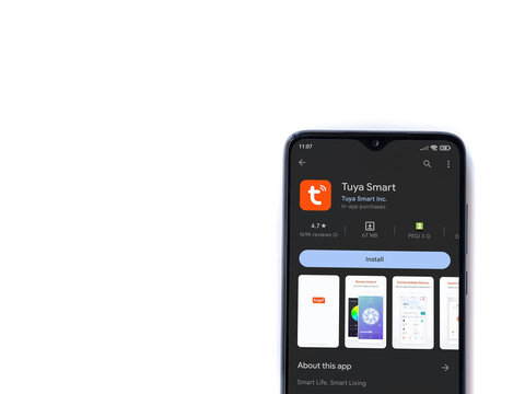 Lod, Israel - July 16,2023: Tuya Smart app play store page on smartphone on white background. Top view flat lay with copy space.
