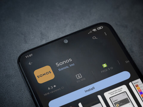 Lod, Israel - July 16,2023: Sonos app play store page on smartphone on a dark marble stone background. Top view flat lay with copy space.