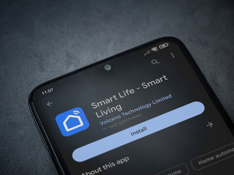 Lod, Israel - July 16,2023: Smart Life app play store page on smartphone on a dark marble stone background. Top view flat lay with copy space.