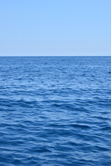 Seascape with water ripples and clear blue sky