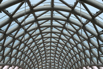 Straight and curved lines in construction and architecture. Abstract geometric background.