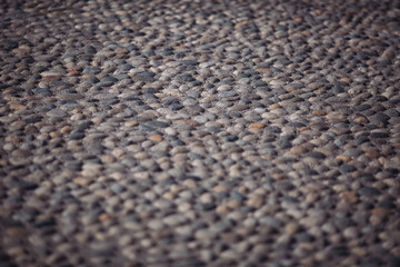 Abstract background. Old cobblestone pavement in perspective. Square Texture Pattern. Rock pavement. Stone texture for the facade.