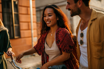 A group of tourists embarks on a bike tour through the city, creating unforgettable memories as they walk along together.