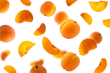 Falling apricots isolated on white. Background of apricot fruit. Sweet apricots isolated on white background cutout. With clipping path.