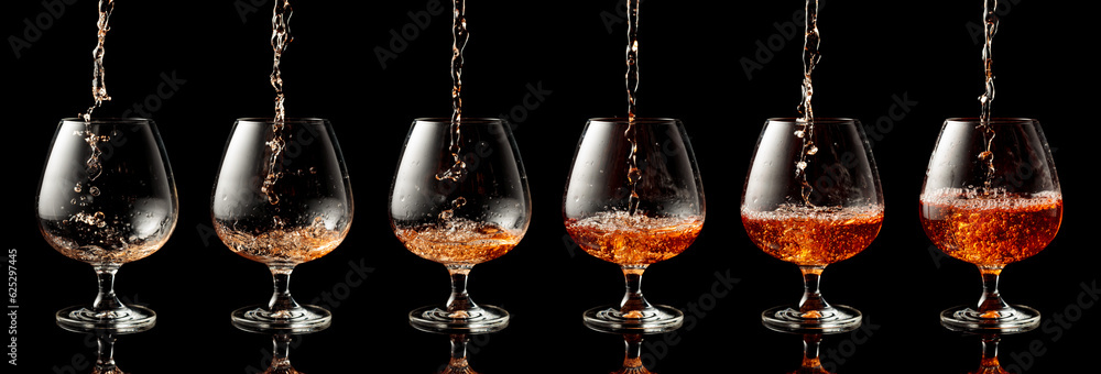 Poster pouring brandy into a glass on a black background.