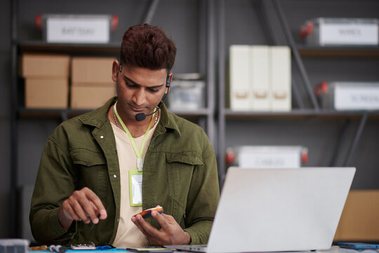 Repairing service manager calling client when fixing issue with his feature phone