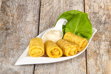 Stuffed pancakes with cream sauce