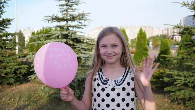 little beautiful girl with balloon portrait smiling and waving goodbye summer 4k