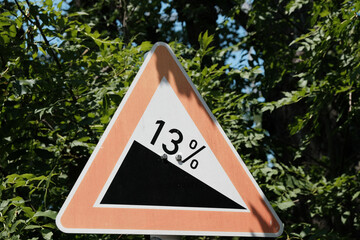 13 percent rise traffic sign outside with nature background