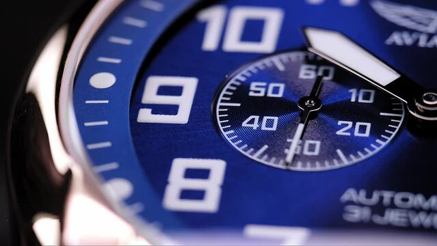 Close Up Of Stylish Luxury Man Wrist Watch With Moving Hand And Multiple Dials. Men's Swiss chronograph watch in metal with sapphire crystal. closeup view of rotating watch , running second arrow