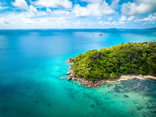 Rolgordijnen Praslin Seychelles tropical island with withe beaches and palm trees. Aerial view of tropical paradise beach with white sand and turquoise crystal clear waters of Indian Ocean © Alexey Oblov