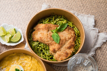 Green sauce pesto pasta with chicken fillet Food buffet peruvian table Assorted dishes gourmet cuisine Peru traditional 