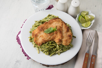 Green sauce pasta with chicken fillet Food buffet peruvian table Assorted dishes gourmet cuisine Peru traditional 
