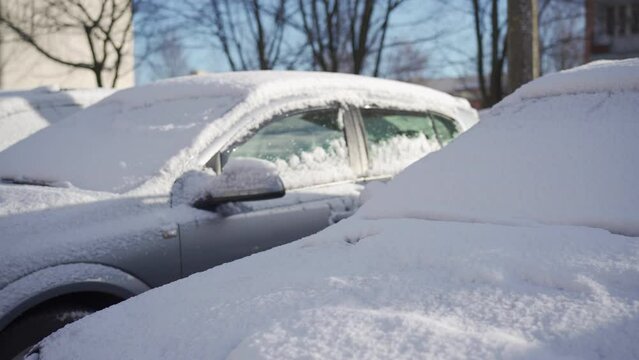 Estate parking lot filled with cars on a cold winter day