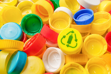 Garbage PET plastic waste sorting icon PET recycling concept. Pile of plastic bottle caps icon recycle symbol reuse icon bottle cap recycling plastic caps pile