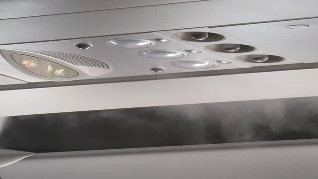 Mist in airplane cabin - fog is caused by vapor condensation.