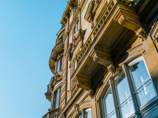 Historic European building with clear sky background. Low angle view highlighting the architectural...