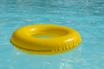 Inflatable ring in clear water. Summer holiday background.