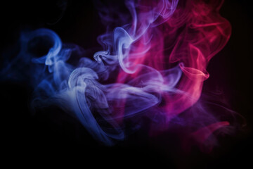 Dramatic smoke and fog in contrasting vivid red, blue, and purple colors. Vivid and intense abstract background or wallpaper. 